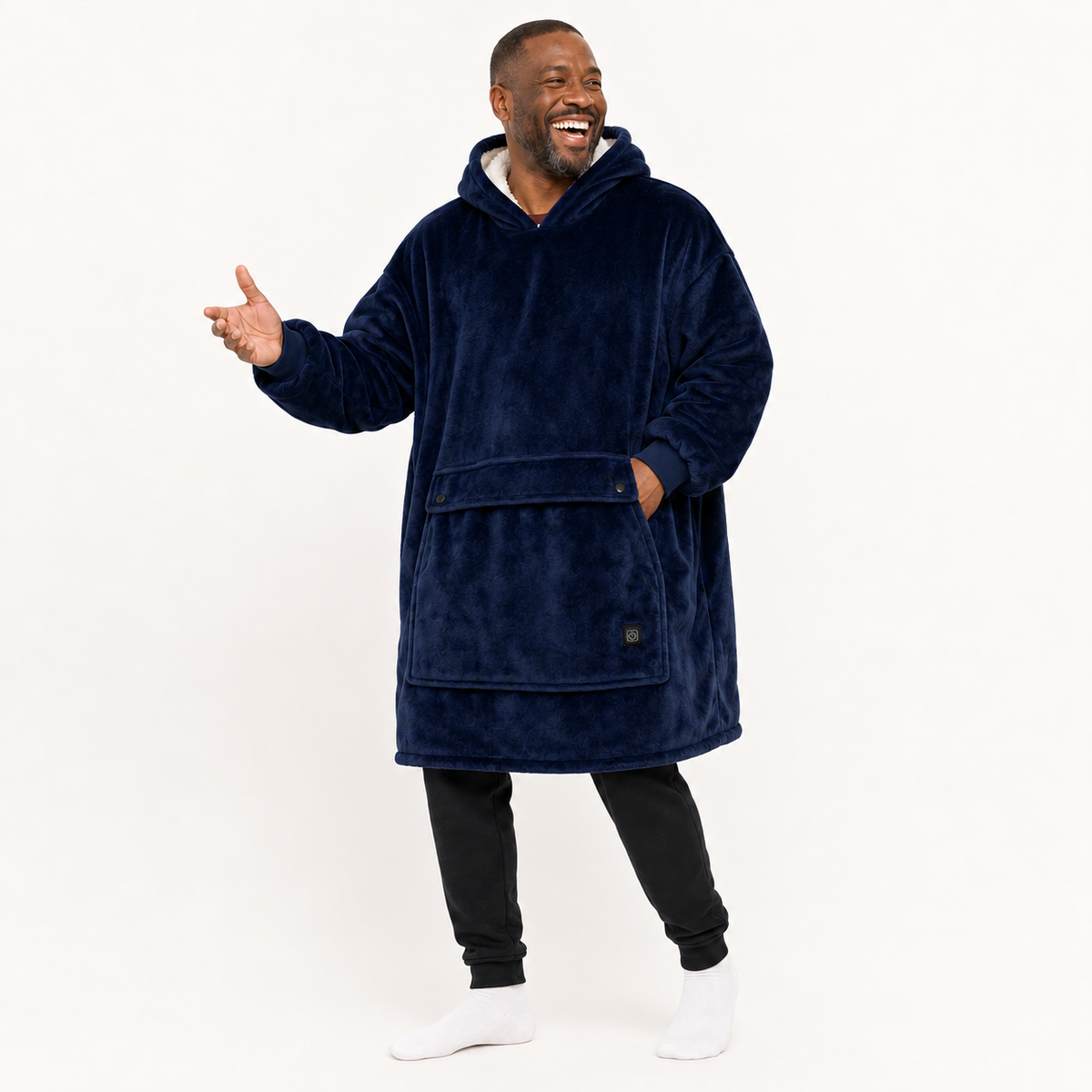 Navy BardiHeat heated fleece worn in a playful studio pose with two pocket-closing buttons