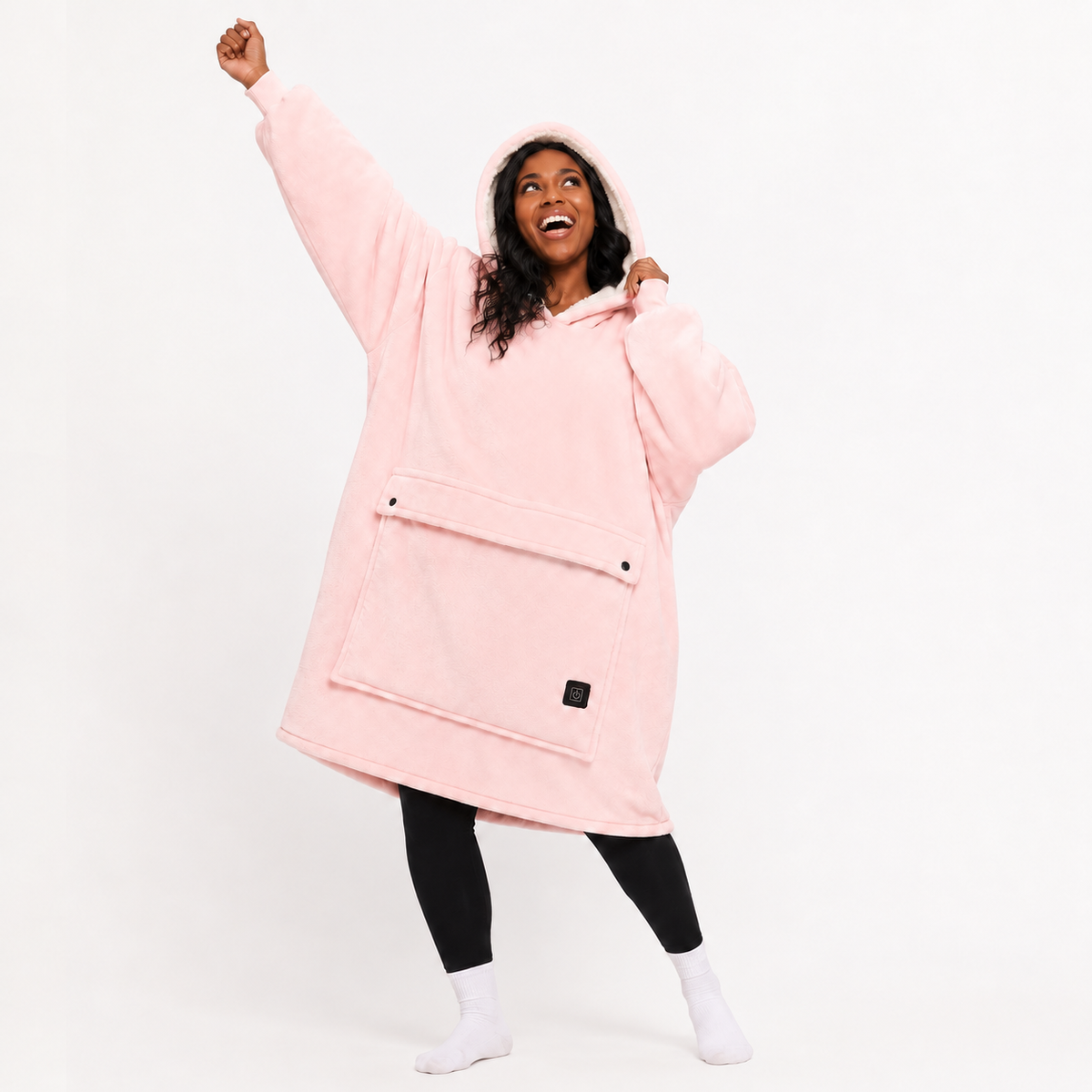 Pink BardiHeat heated fleece worn in a playful studio pose with two pocket-closing buttons