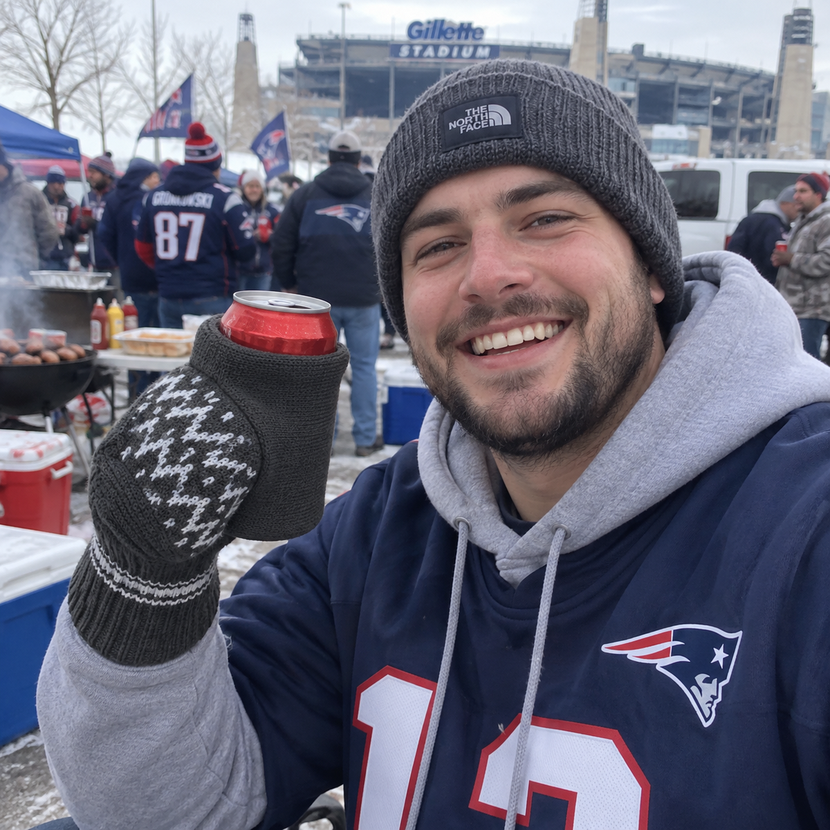 BrewMitt worn while holding a can at a winter outdoor event