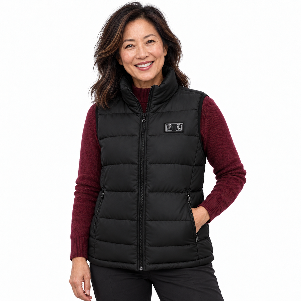 Model wearing the black Heated Gilet in a white studio