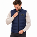 Model wearing the navy Heated Gilet in a white studio
