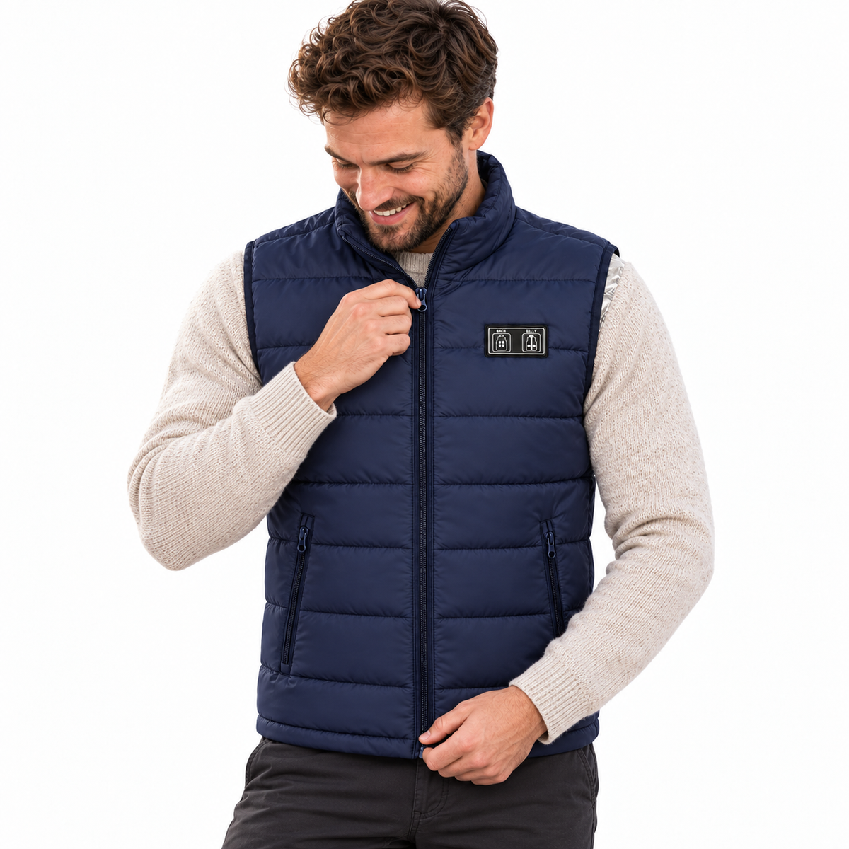 Model wearing the navy Heated Gilet in a white studio