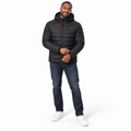 Model wearing the black Heated Outdoor Jacket in a white studio