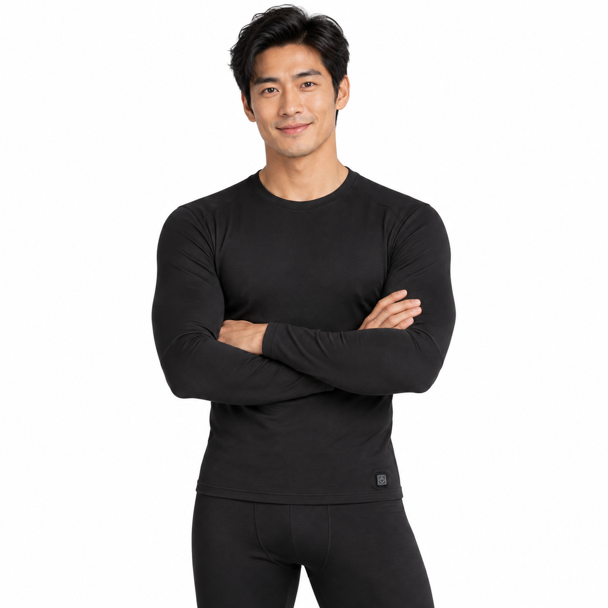 Model wearing men's black Heated Thermal Top in a white studio