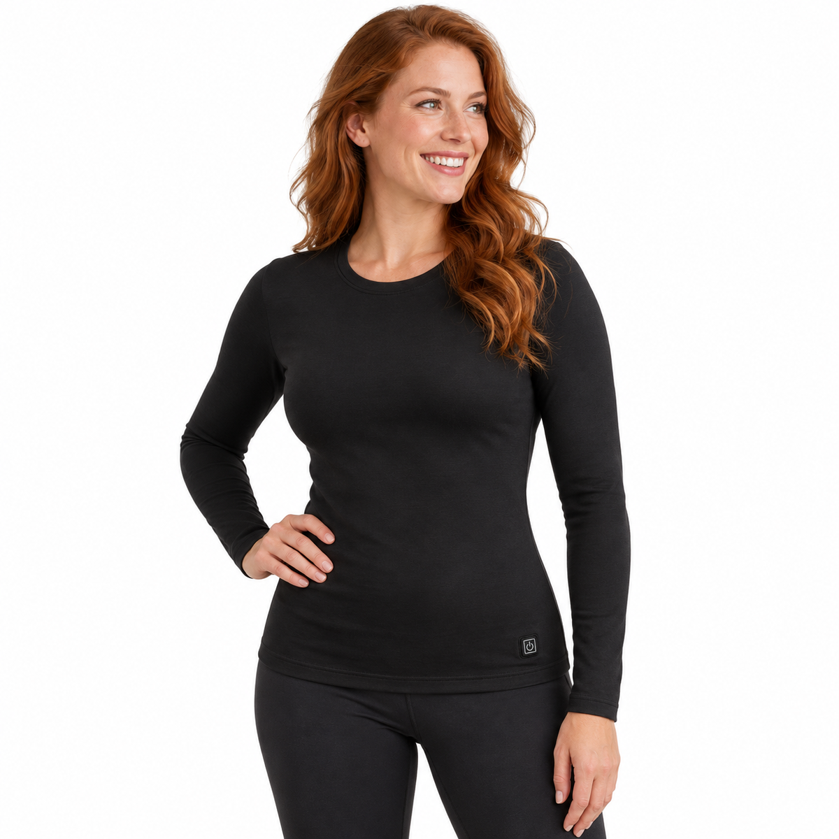 Model wearing women's black Heated Thermal Top in a white studio