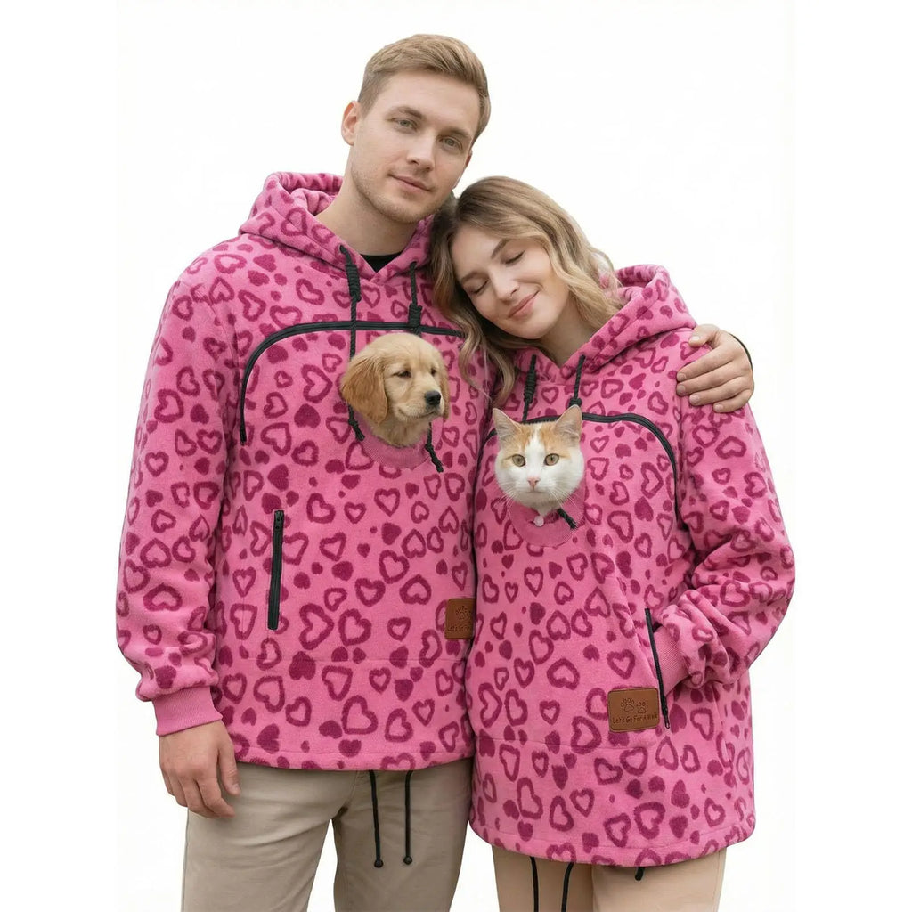 Two people wearing Rose Red Pet Pouch Fleeces with a small dog and cat
