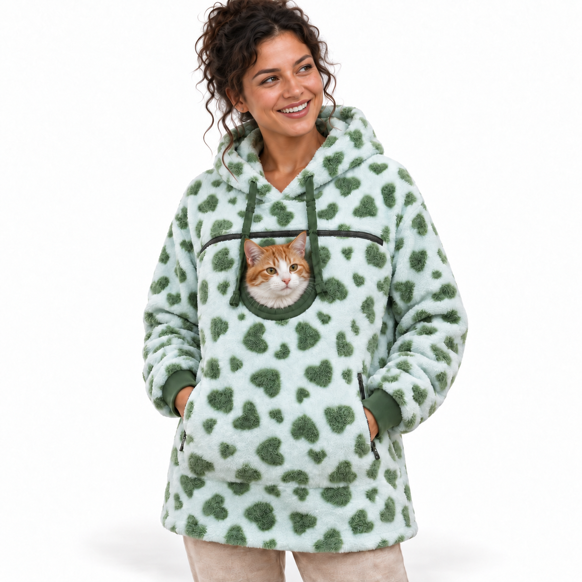 Pet Pouch Fleece in Green Hearts worn with a calm orange and white cat